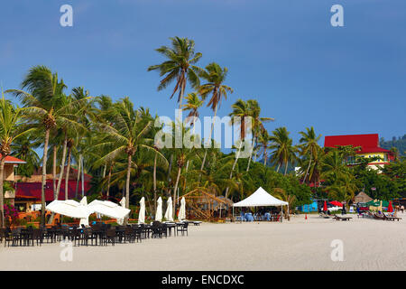 Tropical sandy beach with palm trees in Pantai Cenang, Langkawi, Malaysia Stock Photo