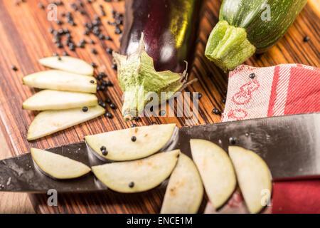 still life with cutted eggplant slices, kitchen knife Stock Photo