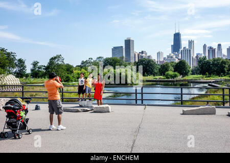 Chicago Illinois,North Side,Lincoln Park,Lincoln Park Zoo,public park,Nature Boardwalk,wildlife marsh habitat,skyline,downtown view,Asian man men male Stock Photo