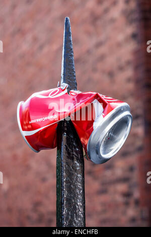 Chicago Illinois,North Side,Lincoln Park,West Fullerton Avenue,Coca-Cola,can,impaled,wrought iron fence post,sharp,IL140908088 Stock Photo