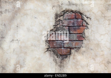 Spot of brick stones on a concrete plastered wall Stock Photo