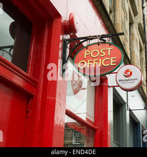 Post Office and Moneygram logo signs in the old town area of Edinburgh, Scotland, UK Stock Photo