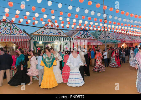 April Fair, Women wearing a traditional flamenco dress, Seville, Region of Andalusia, Spain, Europe Stock Photo