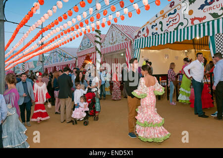 April Fair, Women wearing a traditional flamenco dress, Seville, Region of Andalusia, Spain, Europe Stock Photo