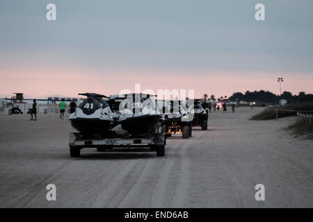 Sunset over Miami Beach, jetskis being towed away for storage Stock Photo