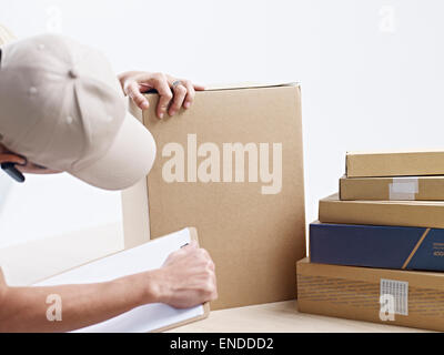 man working in storeroom Stock Photo