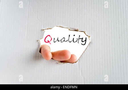 Hand on the cardboard background quality concept Stock Photo