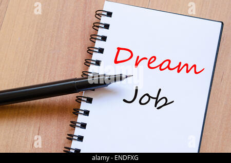 White notepad and ink pen on the wooden desk Dream Job Concept Stock Photo