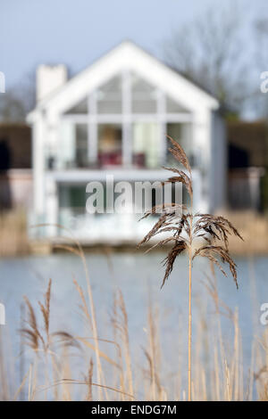 A modern  lakeside holiday home at Lower Mill in the Cotswold water park near Cirencester in Gloucestershire, UK Stock Photo