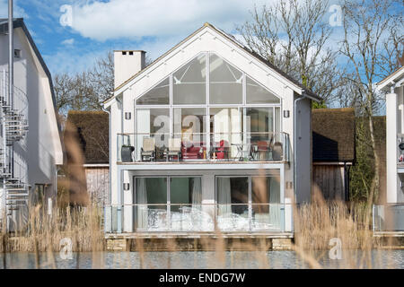 A modern  lakeside holiday home at Lower Mill in the Cotswold water park near Cirencester in Gloucestershire, UK Stock Photo