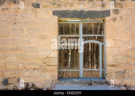Ancient wooden door set in stone wall Stock Photo - Alamy