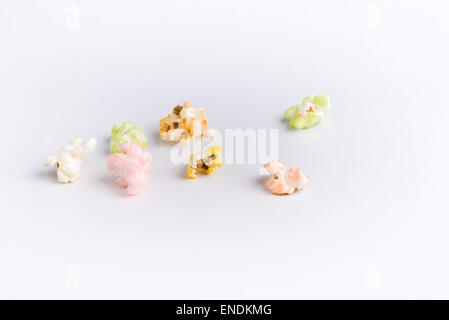 popcorn of many colors on a white background. Stock Photo