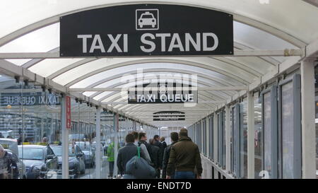 Tourists queue at a taxi rank at Dublin airport during a day of industrial action by drivers at Dublin Bus and Bus Eireann. Stock Photo