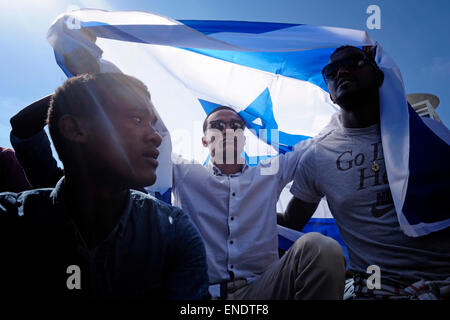 Members of the Beta Israel community also known as Ethiopian Jews protesting in Tel Aviv against racism within Israeli society and police brutality on 03 May 2015. Violence engulfed in central Tel Aviv on Sunday night, as an anti-police brutality protest by Ethiopian-Israelis spun out of control, with protesters throwing rocks and bottles at police who fired stun grenades and charged the square repeatedly on horseback. Stock Photo