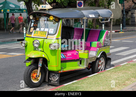 Green and pink tuk-tuk partked in street in Bangkok, Thailand, Asia Stock Photo