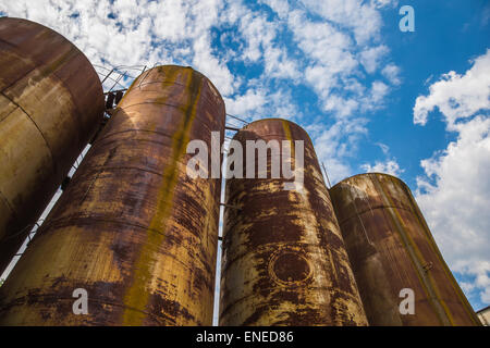 Big old deserted rusty tanks Stock Photo