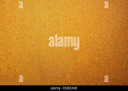 Abstract glittering golden or yellow dust or sand background with blur edges of image Stock Photo