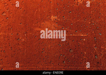 Grunge plaster cement or concrete wall texture red color with scratches Stock Photo