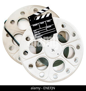 Movie clapper on two 35 mm cinema reels with film isolated on white background Stock Photo