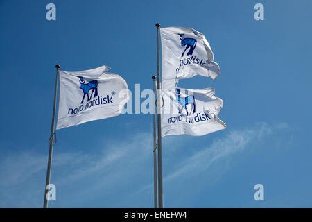 The Novo Nordisk corporate flags at the headquarters in Bagsvaerd (Bagsværd), Copenhagen, Denmark. Stock Photo