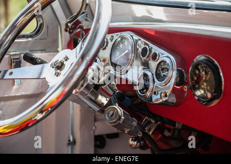 Interior of old retro vintage automobile or car with steering wheel and dashboard Stock Photo