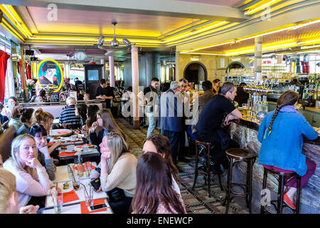 France Paris - The Café des 2 Moulins (French for 'Two Windmills') is a café in the Montmartre area of Paris, located at the junction of Rue Lepic and Rue Cauchois. The café has gained considerable fame since its appearance in the 2001 film, Amélie, in which it is the workplace of the title character. It has since become a popular tourist destination. Stock Photo