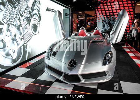 France Paris Mercedes SLR in the Peugeot 108 Tatoo Concept in the Champs-Élysées Mercedes Store Stock Photo