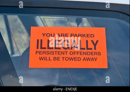 Illegal parking sticker placed on car window in private car park in rural Powys Wales UK Stock Photo