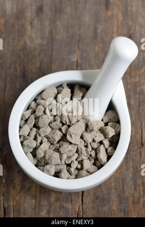 blue stone clay in mortar Stock Photo