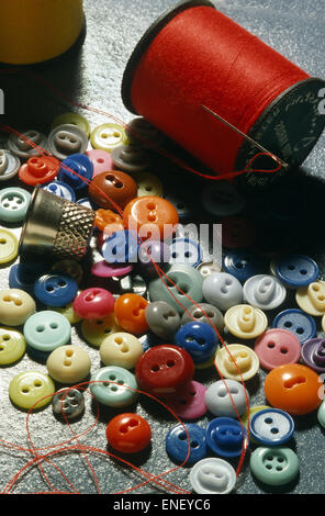 Collection of buttons threads and needles. Stock Photo