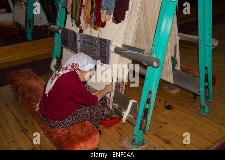 Trainee carpet weaver at the Government training centre in Avanos, Turkey Stock Photo