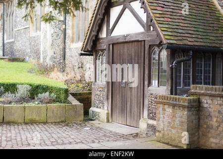 Side view of the Courtyard and main entrance doorway to the oldest church in Guildford, Surrey: St Mary's. Stock Photo