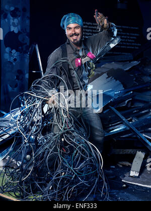 Smiling eletrical contractor with a bunch of wires artistic portrait Stock Photo