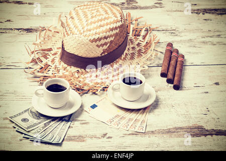 Retro filtered coffees, cigars, money and hats. Summer adventure concept. Stock Photo