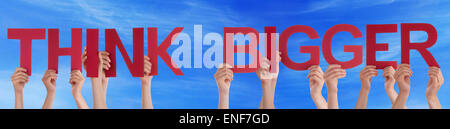 Hands Hold Red Straight Word Think Bigger Blue Sky Stock Photo