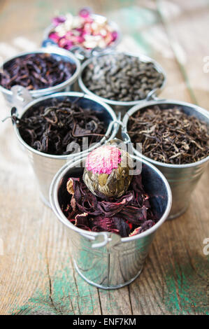 Different types of tea in the metal pots Stock Photo