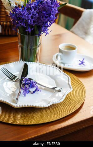 Festive table setting with blue flowers closeup Stock Photo