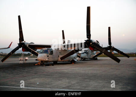 Kathmandu, Nepal/ 4th May, 2015. U.S. Marine V-22 Osprey aircraft parked on the tarmac at Tribhuvan International Airport  May 3, 2015 in Kathmandu, Nepal. The Marines arrived to assist in reaching remote locations using the Ospreys and helicopters to distribute aid and provide relief following the massive earthquake that struck the mountain kingdom. The devastating earthquake killed over 7,000 people and destroyed large parts of the ancient historic city. Stock Photo