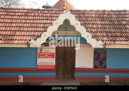 A large notice at the main door of a Hindu temple,' Entry Strictly for Hindus Only'  The temple is at Fort Cochin, Kochi in the State of Kerala in In Stock Photo