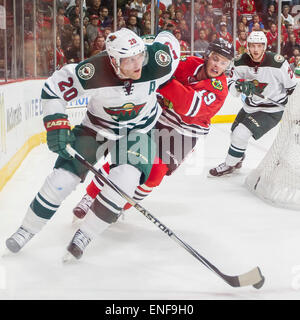 Chicago, IL, USA. 01st May, 2015. Chicago, Illinois, U.S. - Blackhawk #19 Jonathan Toews chases Wild #20 Ryan Suter during the National Hockey League Playoff game between the Chicago Blackhawks and the Minnesota Wild at the United Center in Chicago, IL. Mike Wulf/CSM/Alamy Live News Stock Photo