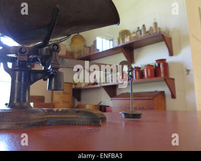 Antique metal scale is part of an old store on display at the Bennington Museum in Bennington, Vermont. Stock Photo