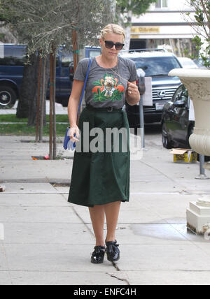 Cougar Town star Busy Philipps out in West Hollywood with family all wearing matching grey t-shirt portraying a flamingo and dog in jewelry t-shirt  Featuring: Busy Philipps Where: Los Angeles, United States When: 30 Oct 2014 Stock Photo