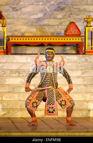 Khon masked drama, Thailand. Actor / dancer, traditional costume, mask, striking a characteristically Thai pose. Ramayana epic. Stock Photo