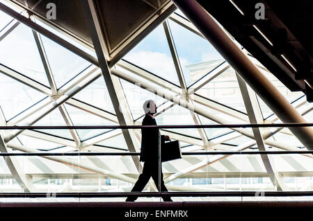 Businessman and architecture at King's Cross railway station in London, UK Stock Photo