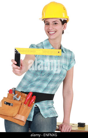 Woman holding set square Stock Photo