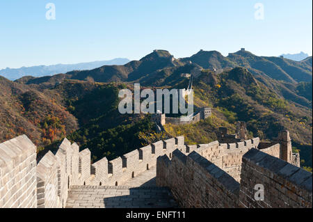 Great Wall of China, historical border fortress with battlements, restored section with watchtowers, winding its way over Stock Photo