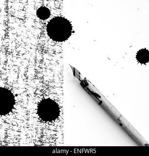 Antique pen on scratched and ink spot Stock Photo