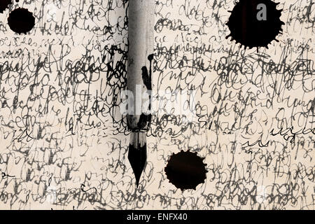 Antique pen on scratched and ink spot Stock Photo