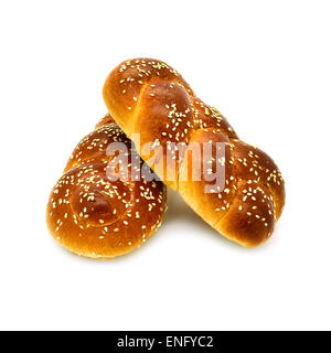 Two buns with sesame seeds on a white background. Stock Photo