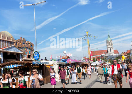 Visitors walk in fine weather on the Wiesn Octoberfest Stock Photo